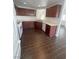 Functional kitchen with white appliances, wooden cabinets, and tile flooring at 4236 Thomas Patrick Ave, North Las Vegas, NV 89032