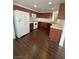 Well-equipped kitchen featuring wooden cabinets, white appliances, and ample counter space at 4236 Thomas Patrick Ave, North Las Vegas, NV 89032