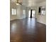 Spacious living room with tile floors, ceiling fan, and sliding glass door to backyard at 4236 Thomas Patrick Ave, North Las Vegas, NV 89032