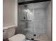 This bathroom features a tiled walk-in shower with glass doors at 427 Wright Way, Henderson, NV 89015