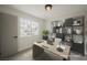 Bright office features modern desk, stylish shelving, and a sunlit window view at 427 Wright Way, Henderson, NV 89015