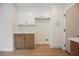 Kitchen with ample pantry storage, floating shelves, and two-tone cabinetry at 427 Wright Way, Henderson, NV 89015
