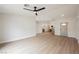 Bright and airy living room boasts modern flooring and leads into an open-concept kitchen at 427 Wright Way, Henderson, NV 89015