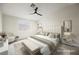 Bright main bedroom featuring neutral colors, a ceiling fan and decorative artwork at 427 Wright Way, Henderson, NV 89015