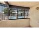 Private balcony featuring ornate wrought iron and a view of the community pool at 5070 Jeffreys St # 101, Las Vegas, NV 89119