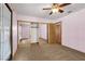 Cozy bedroom with mirrored closet and ceiling fan at 5070 Jeffreys St # 101, Las Vegas, NV 89119