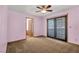 Bedroom featuring sliding doors to a small deck at 5070 Jeffreys St # 101, Las Vegas, NV 89119