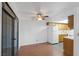 Bright dining area with hardwood floors, a ceiling fan, and sliding glass doors to a balcony at 5070 Jeffreys St # 101, Las Vegas, NV 89119