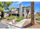 Charming two-story home with a turret, landscaped yard, and a combination of natural and xeriscape landscaping at 5070 Jeffreys St # 101, Las Vegas, NV 89119