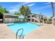 Enjoy the community pool with relaxing lounge chairs and well-manicured landscaping, perfect for summer days at 5070 Jeffreys St # 101, Las Vegas, NV 89119