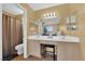Inviting bathroom with double vanity, toilet and standing shower at 5335 Duralite St # 203, Las Vegas, NV 89122