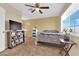 Cozy carpeted bedroom with natural light, ceiling fan, and standard closet at 5335 Duralite St # 203, Las Vegas, NV 89122