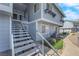 Exterior of building with stairwell, sidewalk, and landscaping at 5335 Duralite St # 203, Las Vegas, NV 89122