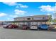 Exterior view of building with covered parking and tidy landscaping at 5335 Duralite St # 203, Las Vegas, NV 89122