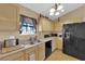 Functional kitchen with a stainless steel sink, modern appliances, and a neutral color scheme at 5335 Duralite St # 203, Las Vegas, NV 89122
