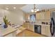 Bright kitchen featuring light wood cabinets, stainless steel appliances, and functional counter space at 5335 Duralite St # 203, Las Vegas, NV 89122