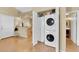 Bright laundry room features a stackable washer and dryer and ample built in storage at 5335 Duralite St # 203, Las Vegas, NV 89122