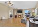 Spacious living room with a vaulted ceiling, fireplace, and an adjacent view of a bedroom at 5335 Duralite St # 203, Las Vegas, NV 89122