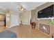 Open living space with tile flooring, a fireplace, and seamless access to the kitchen at 5335 Duralite St # 203, Las Vegas, NV 89122