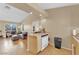 Open living space that connects the living room and kitchen with natural light and a breakfast bar at 5335 Duralite St # 203, Las Vegas, NV 89122