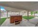 Backyard patio with a hot tub and ample room for outdoor entertainment and relaxation at 57 Marion Dr, Las Vegas, NV 89110