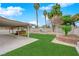 Large backyard with covered patio and hot tub, offering ample space for leisure and outdoor activities at 57 Marion Dr, Las Vegas, NV 89110