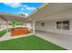 An entertainer's backyard with a hot tub and covered patio space at 57 Marion Dr, Las Vegas, NV 89110