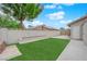 The backyard has a lawn and a well-maintained fence with landscaping at 57 Marion Dr, Las Vegas, NV 89110
