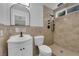 Updated bathroom features a modern vanity, tile shower with rainfall shower head and tile surround at 57 Marion Dr, Las Vegas, NV 89110