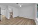 Bedroom with wood-look floors and ensuite bathroom with modern vanity at 57 Marion Dr, Las Vegas, NV 89110