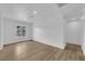 Bedroom featuring wood-look floors, large window and recessed lights at 57 Marion Dr, Las Vegas, NV 89110