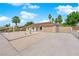 Charming single-story home with a two-car garage, desert landscaping and RV parking at 57 Marion Dr, Las Vegas, NV 89110