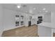 Bright kitchen featuring white cabinets, stainless steel appliances, and a modern aesthetic at 57 Marion Dr, Las Vegas, NV 89110