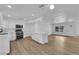 Spacious kitchen open to the dining area with a large center island and stainless appliances at 57 Marion Dr, Las Vegas, NV 89110