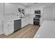 Well-lit kitchen featuring stainless steel appliances, white cabinetry, and ample counter space at 57 Marion Dr, Las Vegas, NV 89110