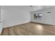 Bright living room with wood-look floors and white trim at 57 Marion Dr, Las Vegas, NV 89110
