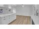 Open living space with light, wood-look floors, recessed lighting, and modern finishes at 57 Marion Dr, Las Vegas, NV 89110
