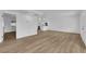 Open-concept living room and kitchen feature bright white walls and recessed lighting at 57 Marion Dr, Las Vegas, NV 89110