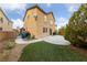 A backyard with a concrete patio, grass, and landscaping; a great area for entertaining and relaxing at 6030 Hidden Summit St, North Las Vegas, NV 89031