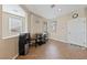 Cozy breakfast nook features natural light, tile floors, a modern water cooler, and a small dining table at 6030 Hidden Summit St, North Las Vegas, NV 89031