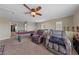 Spacious game room with plush seating, pool table, and a ceiling fan at 6030 Hidden Summit St, North Las Vegas, NV 89031
