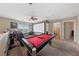 Entertaining game room featuring a pool table, large projection screen, and comfortable seating at 6030 Hidden Summit St, North Las Vegas, NV 89031