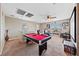 Inviting game room with a pool table, comfortable seating, and plenty of natural light at 6030 Hidden Summit St, North Las Vegas, NV 89031