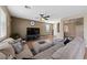 Spacious living room with comfortable seating, a large TV, and plenty of natural light creating a welcoming space at 6030 Hidden Summit St, North Las Vegas, NV 89031