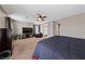 Spacious bedroom with modern decor, plush seating, and ample natural light at 6030 Hidden Summit St, North Las Vegas, NV 89031