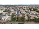 Wide aerial view of a residential neighborhood with similar houses and well-kept landscaping at 8112 Broken Spur Ln, Las Vegas, NV 89131
