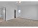 Neutral Primary bedroom with carpet, ensuite bathroom and walk-in closet at 8112 Broken Spur Ln, Las Vegas, NV 89131