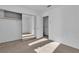 Bedroom featuring a closet with mirrored doors and neutral carpet at 8112 Broken Spur Ln, Las Vegas, NV 89131