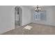 Dining area with carpet flooring, a chandelier, and bright natural light at 8112 Broken Spur Ln, Las Vegas, NV 89131