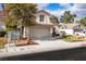 Charming home featuring a two-car garage and well-maintained landscaping at 8112 Broken Spur Ln, Las Vegas, NV 89131